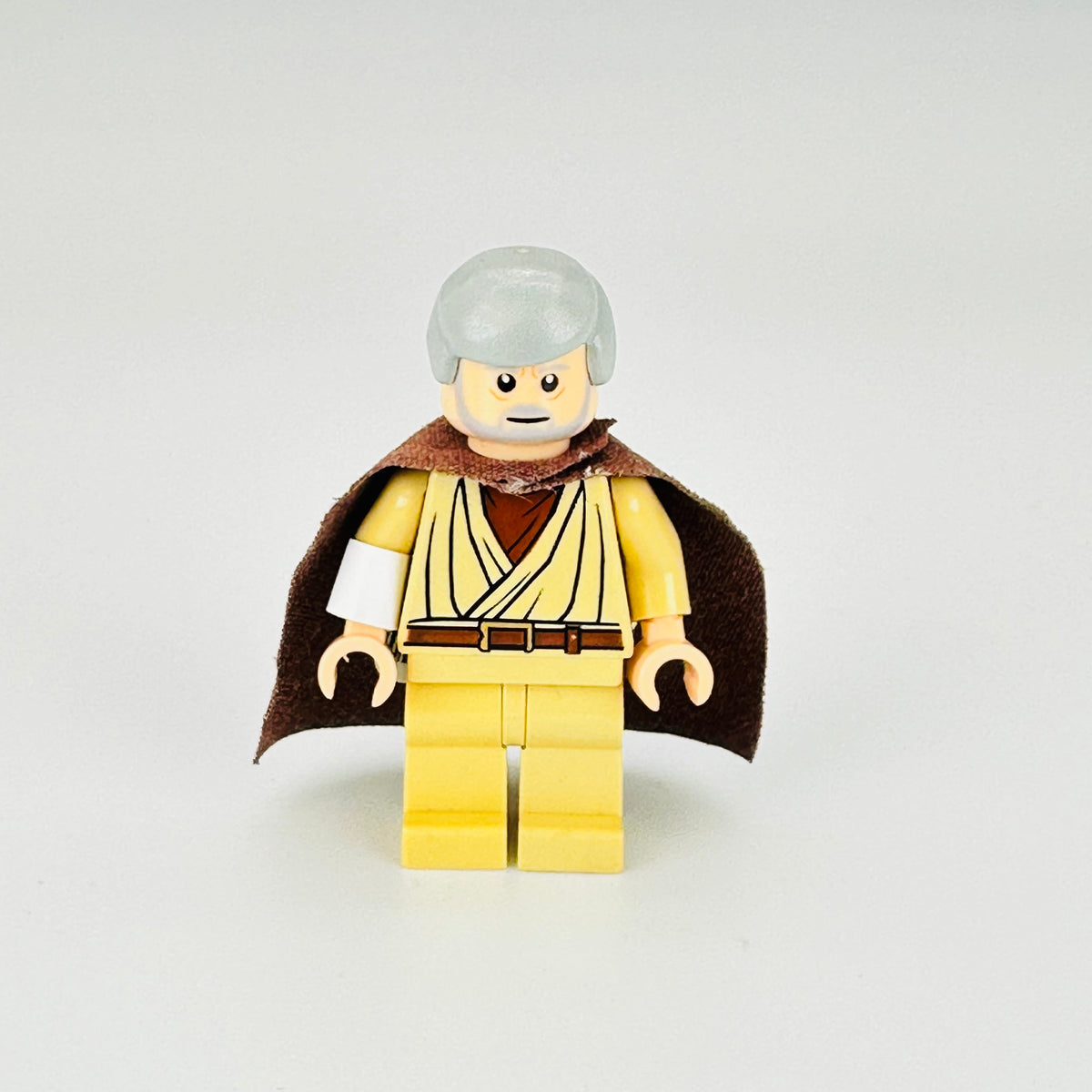 sw0637a: Obi Wan Kenobi (old, standard cape, with pupils) product image 2, provided for visual reference and product detail