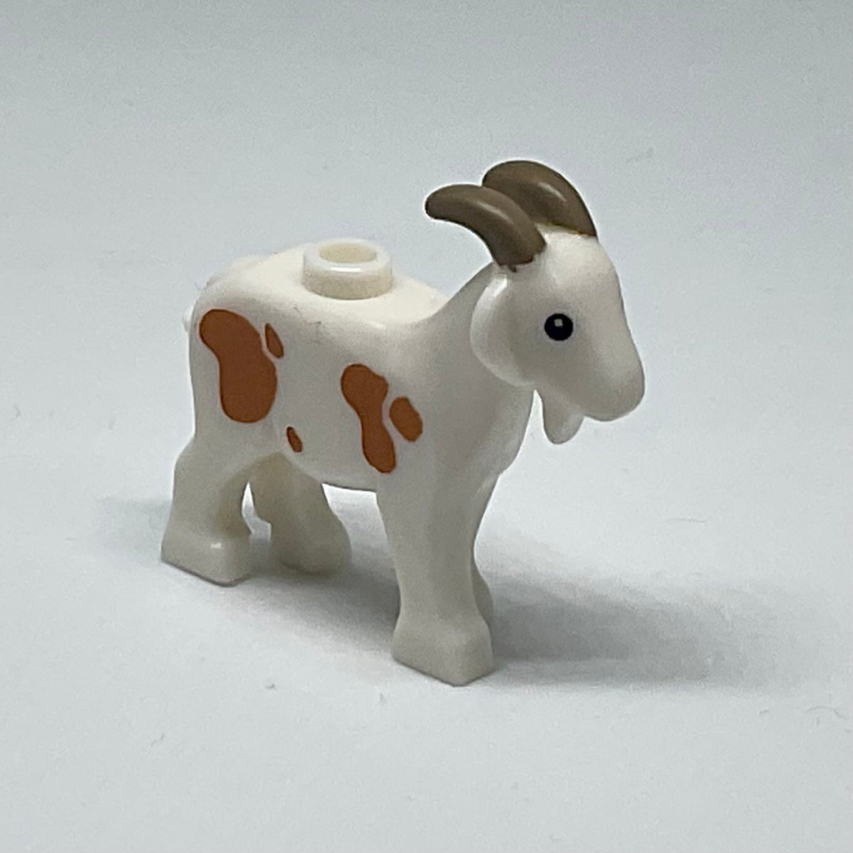 Goat with Black Eyes, Dark Tan Horns and Medium Nougat Spots Pattern product image 1, provided for visual reference and